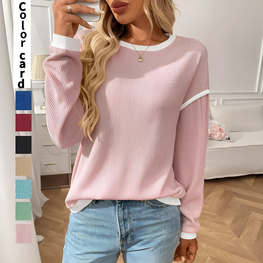 Women's loose-fit long sleeve round neck pullover top in light blue polyester fabric.