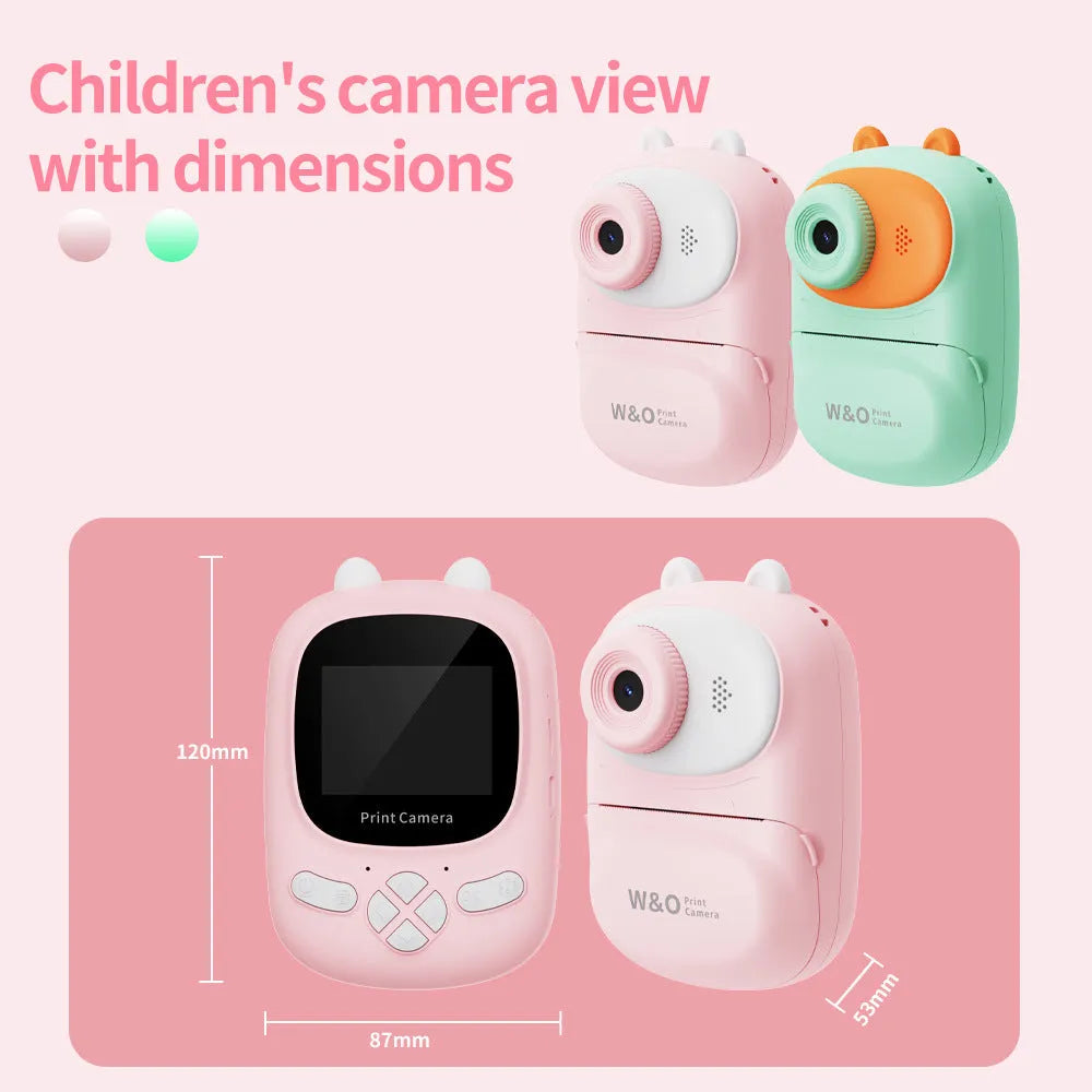 Q2 children's camera in green with polaroid instant print function, lanyard, and stickers on white background