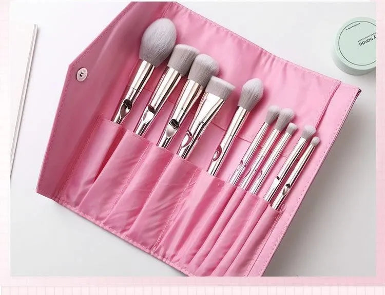 Pink PVC makeup brush set with non-slip grip handle and soft bristles on a light background