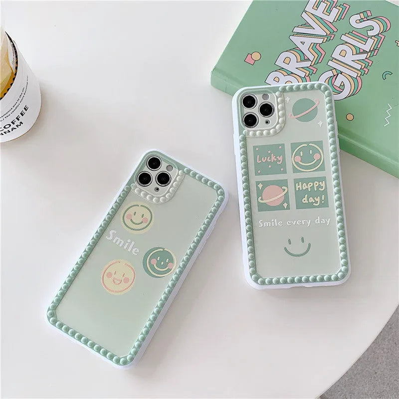 Green TPU phone case with geometric smiley face and polka dot pattern for multiple iPhone models.