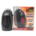 Black mini electric ceramic heater with digital display and a rotating three-prong plug on a desk.