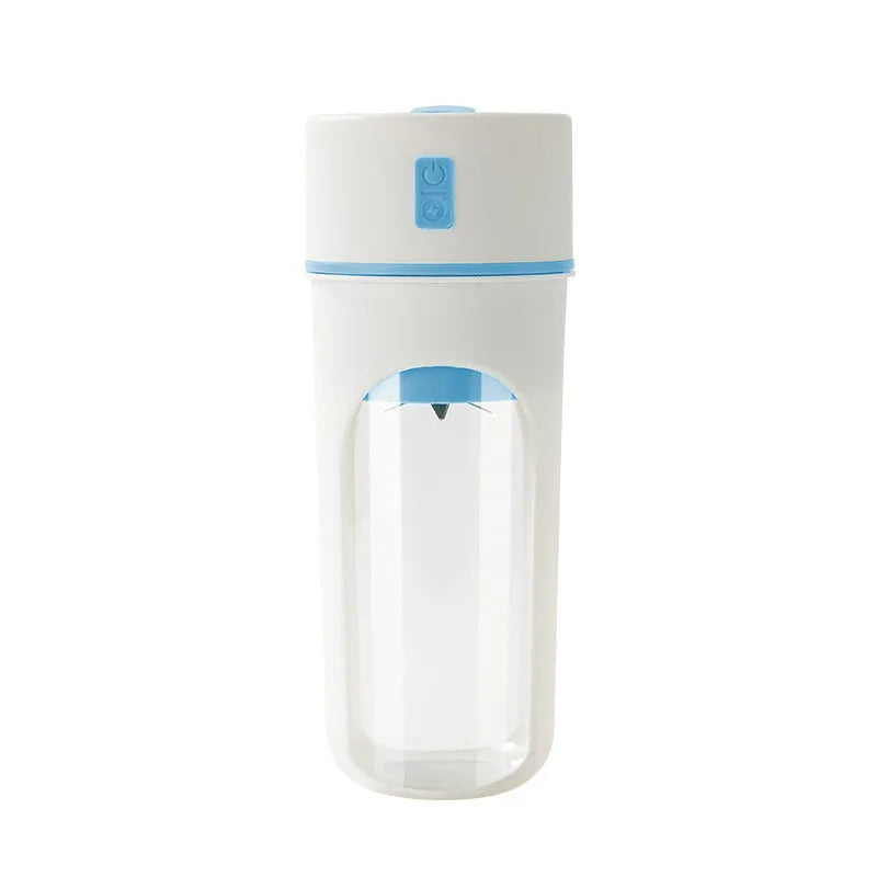 Blue portable electric juicer with USB charging cable next to a cup of blended fruit smoothie.