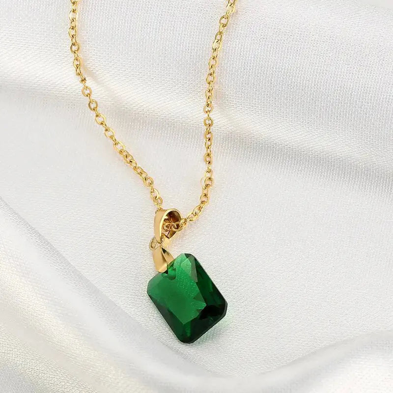 Copper geometric rectangular pendant necklace in XL1006 green on an O-ring chain.