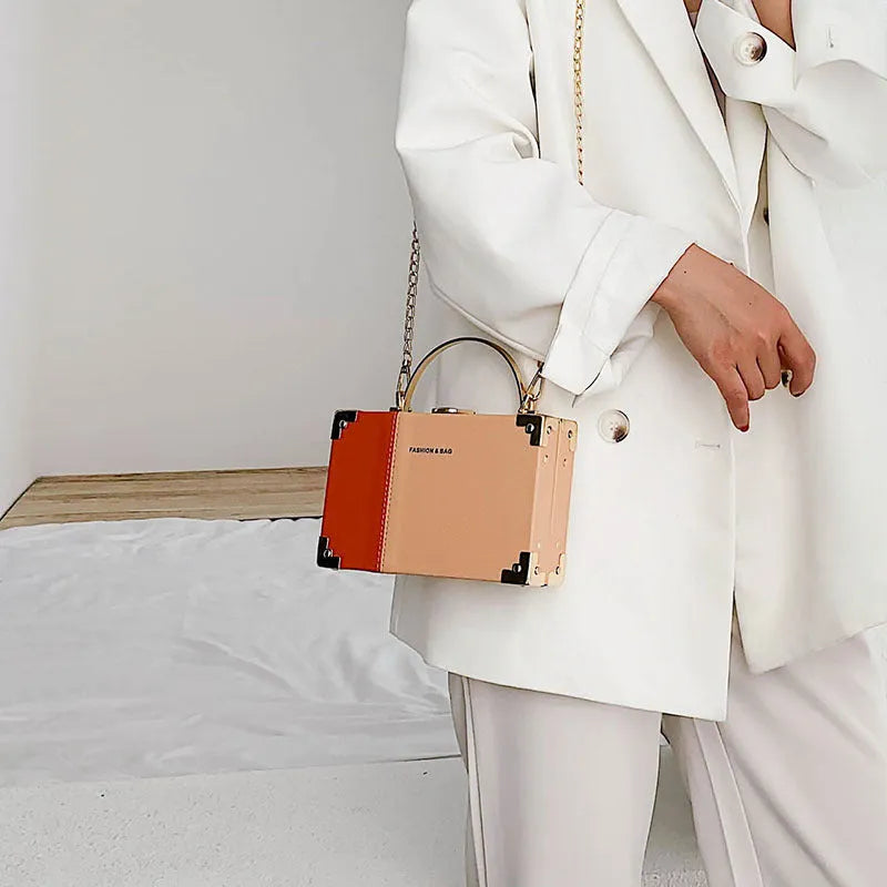 Handle box design clutch bag in orange with long chain, PU leather, 19cm length