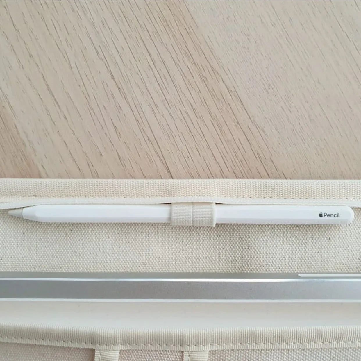 Canvas tablet storage bag with zipper opening and soft handle designed for 12-inch devices, shown in black and white colours
