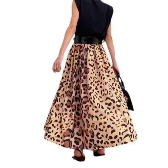 Brown leopard print women's long A-line skirt with a full hem on a hanger