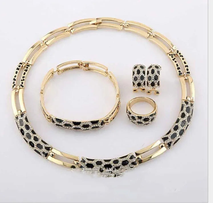 Costume jewellery set for women with 18K electroplated alloy, drop oil detail, and water drill accents in black, purple, or white.