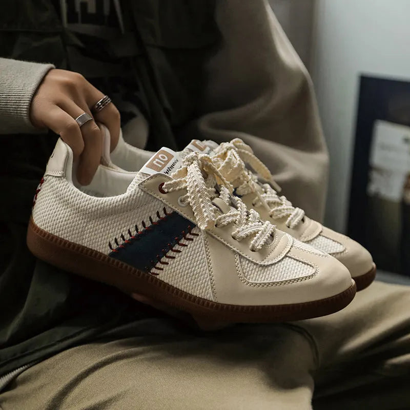 White mesh men's fashion casual exercise sneakers with flat heel on display