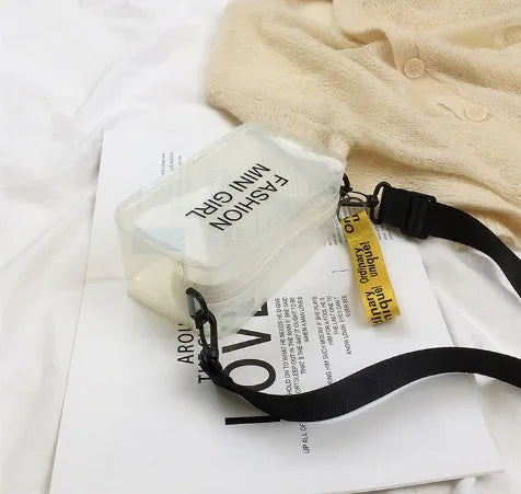 A transparent square jelly cross-body bag in a choice of colours, shown with an adjustable strap and a mobile phone inside.