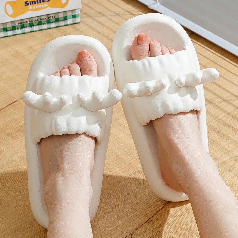 White EVA flip flop slippers with a cute deer horn design and a non-slip sole.