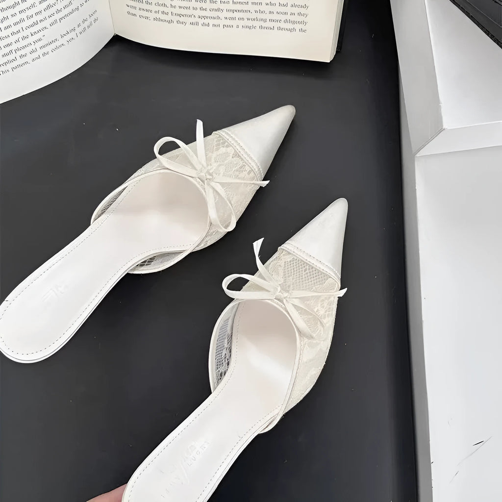 Women's light brown high heels with a pointed toe, decorative bowknot, and mesh upper.