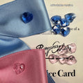 A blue dog hair band with a large princess-style bow and adjustable tension strap on a white background.