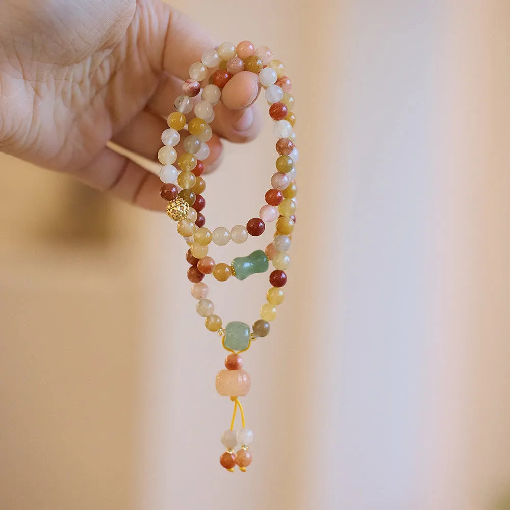 Women's Jinsi Jade bracelet with three-circle pumpkin design and tassels for 14-16cm wrists