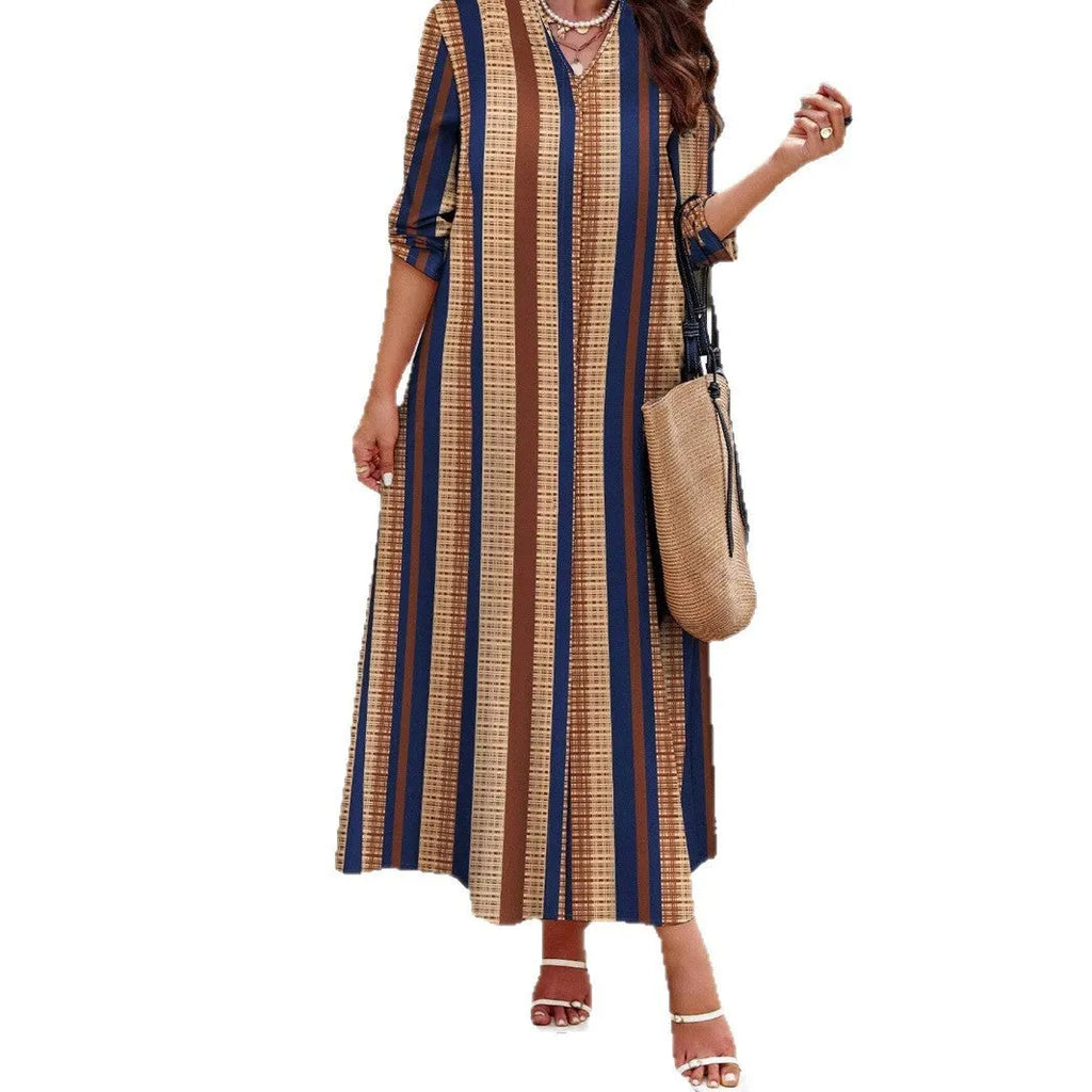 Women's camel coloured knitted dress with vertical stripes, V-neck, and long A-line silhouette