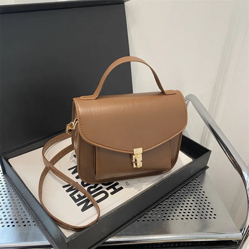 Retro style square messenger bag in PU leather, shown in black colour with visible sewing lines.
