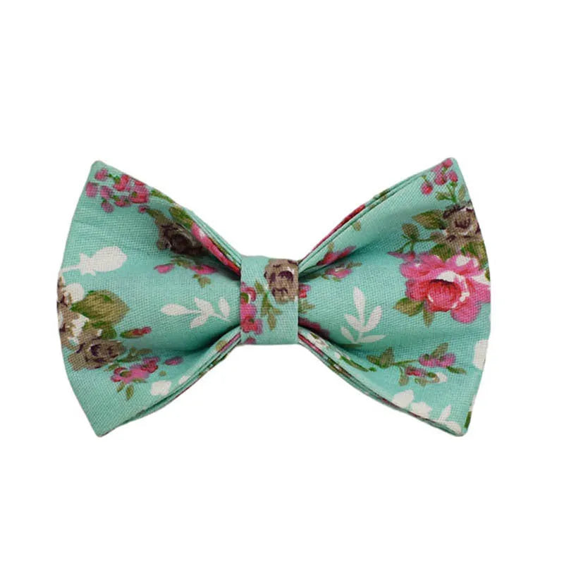 Fabric dog collar set with rose pattern detachable bow, matching leash, and optional vest in green background