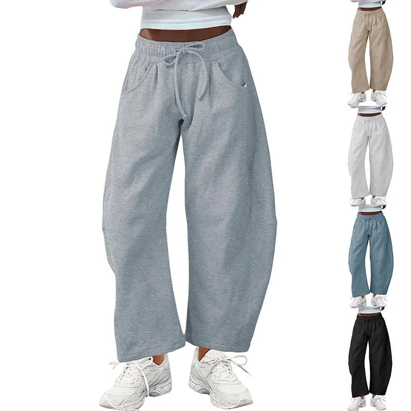 Loose cropped sweatpants with drawstring waist and side pockets in apricot colour