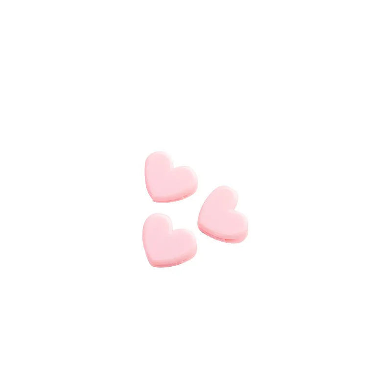 Pink heart-shaped love clip measuring 3.2 x 2.5cm for holding a photo or note