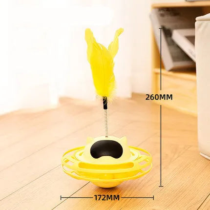 Pink rotating cat tumbler toy measuring 17 by 10 centimetres on a flat surface