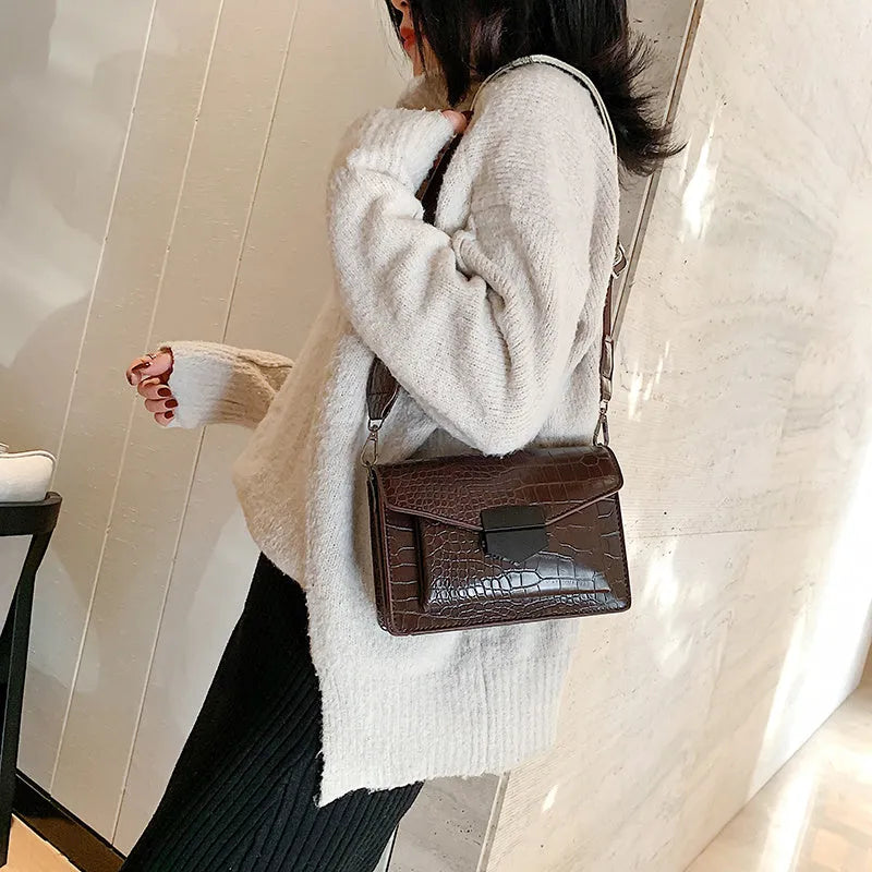 PU crossbody bag in four colours showing 20cm width and 14cm height