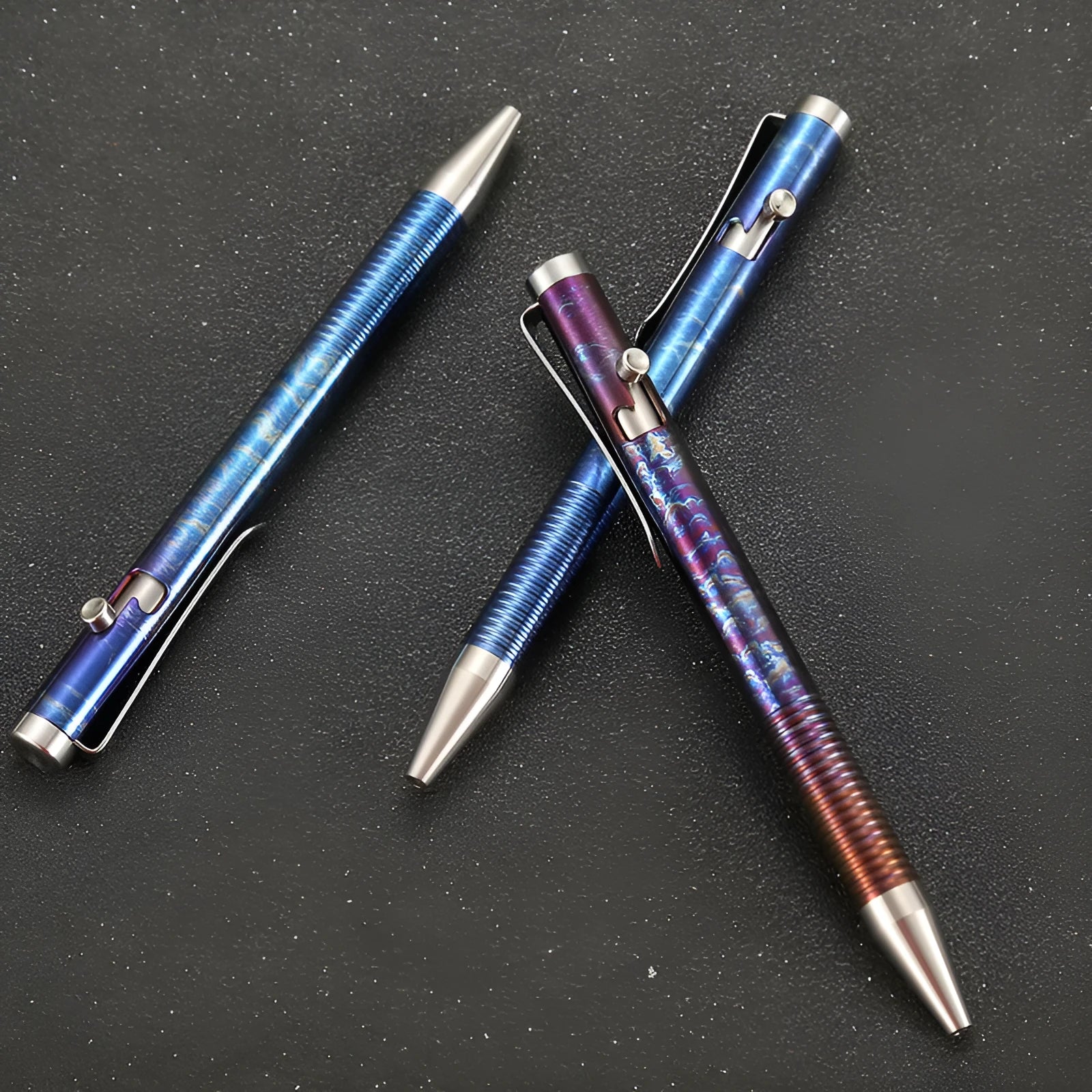 Titanium alloy gun bolt handle ball pen in a multicolour phantom finish, showing bolt action mechanism.
