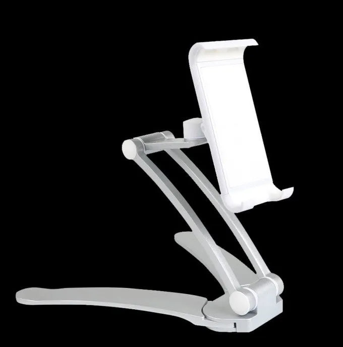 Silver aluminium desktop stand holding a tablet at an angle on a wooden desk.