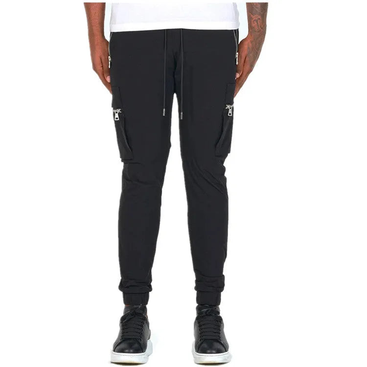 Men's zipper multi-pocket loose fit trousers in black, 95% polyester chemical fiber blend, with belt and small leg opening