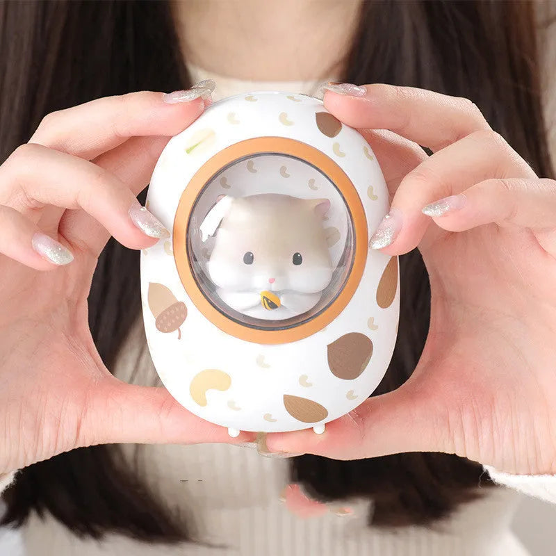 White Hamster hand warmer and power bank unit showing compact dual-function design.
