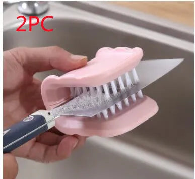 Blue U-shaped plastic brush for cleaning knives and forks in kitchen sink