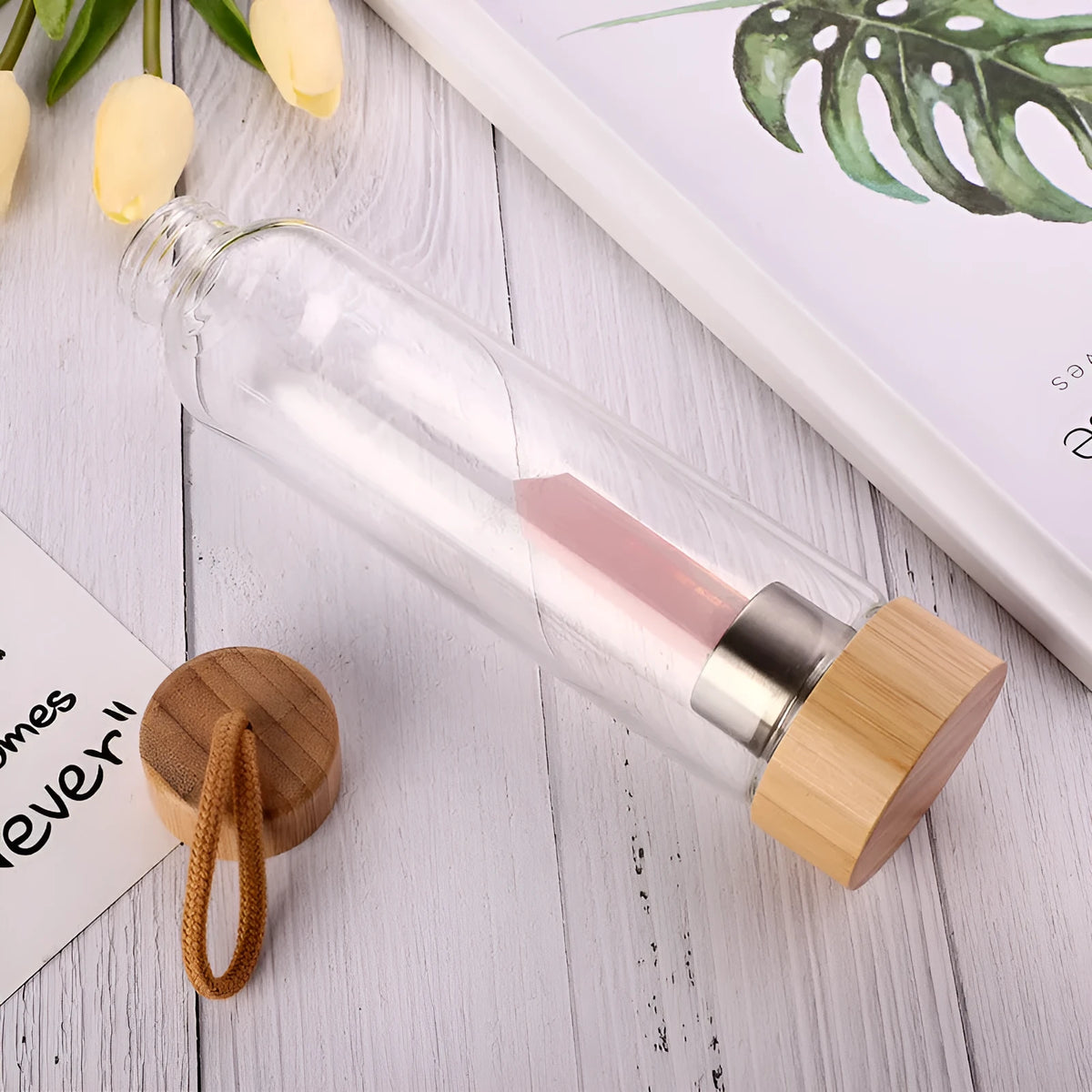 Crystal infused glass water bottle with bamboo lid and crystal stone in black colour