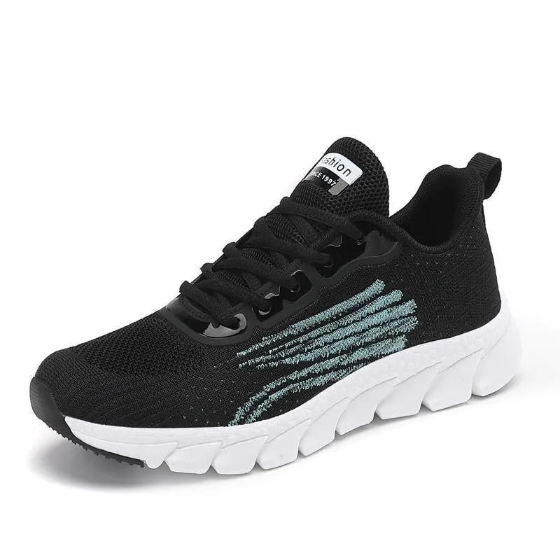 Women's black and white casual running sneakers with cross strap design and MD sole
