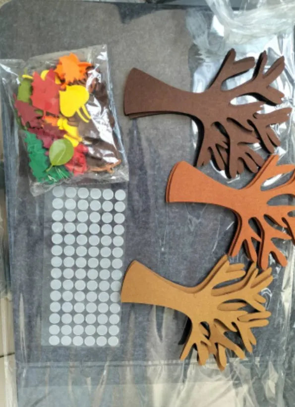 Felt tree wall hanging set with 96 non-woven fabric pieces in a tree arrangement on a wall