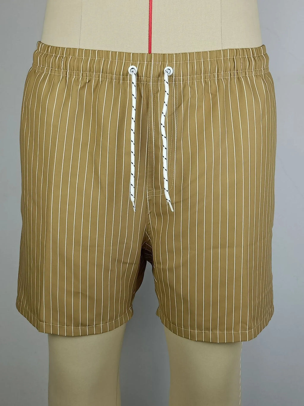 Men's navy blue striped polyester shorts with a straight leg and triangle lining, laid flat.