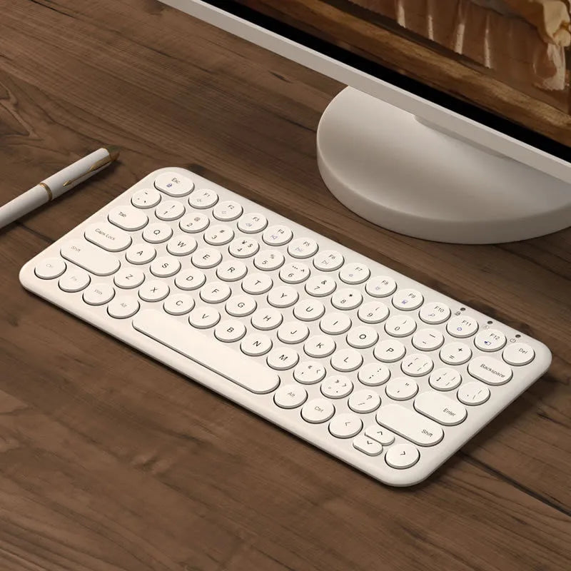 Mute brand ultra-thin wireless keyboard and mouse set with USB receiver on a wooden desk.