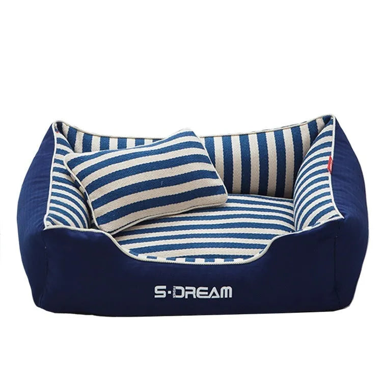 Navy stripes washable dog kennel mat with removable fabric pillow in a pet crate.