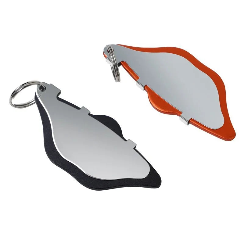 Mountain bike disc brake pads in black and orange with adjustment flap