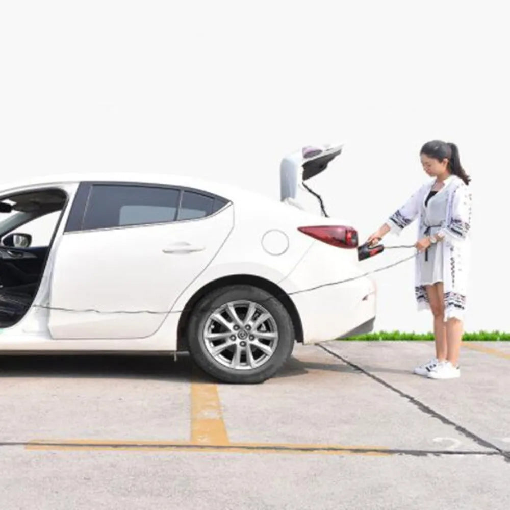 Handheld 120W car vacuum cleaner with brush and nozzles on car seat