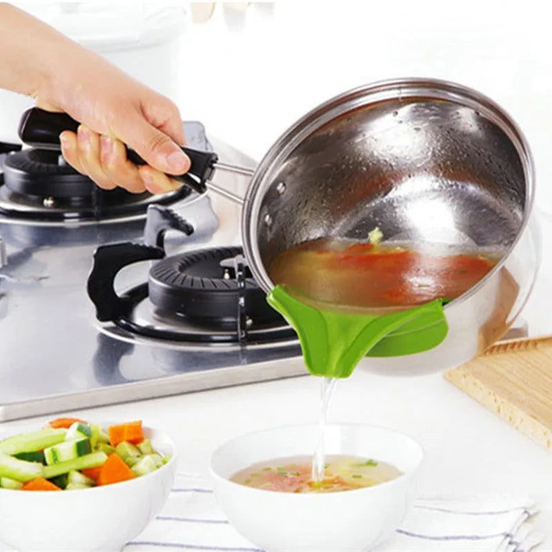 Green silicone kitchen funnel with curved design for clamping onto circular pot rims.