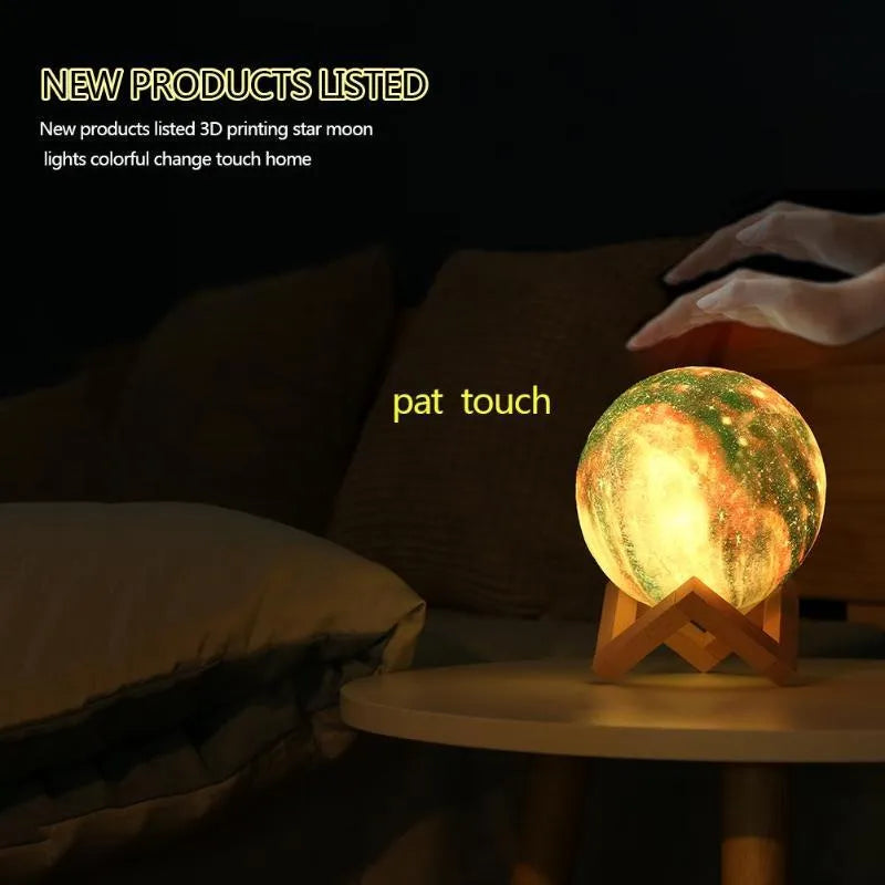 3D printed white moon lamp night light glowing on a surface next to its remote control.