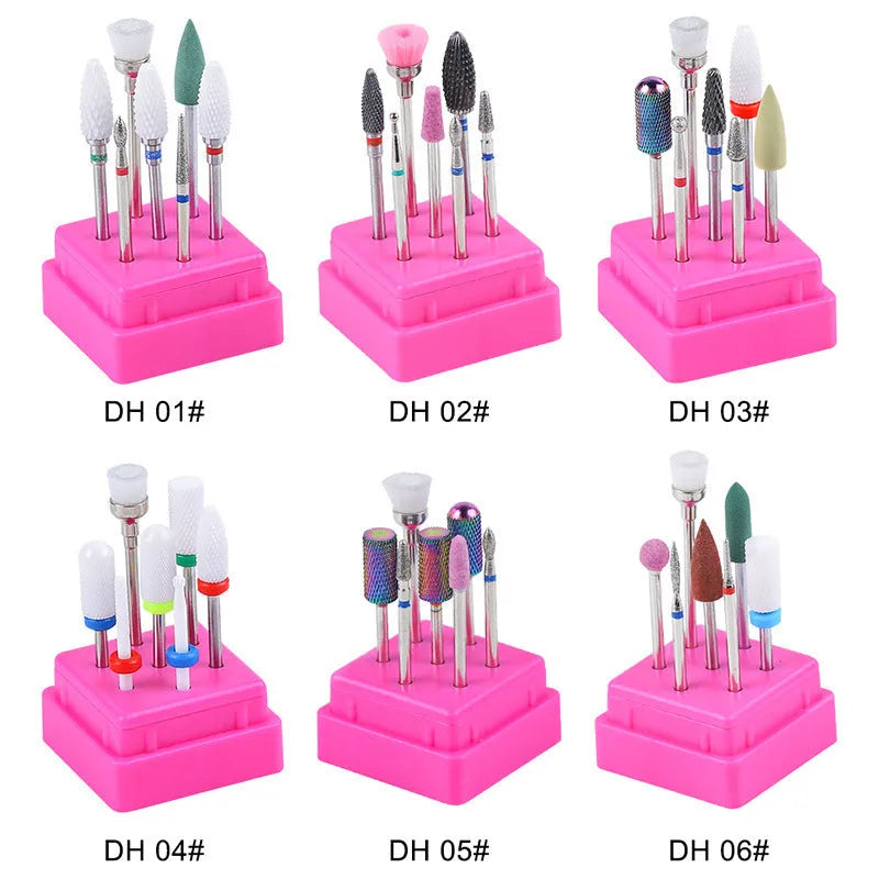 Set of seven tungsten steel nail drill bits and a brush in a transparent plastic case.
