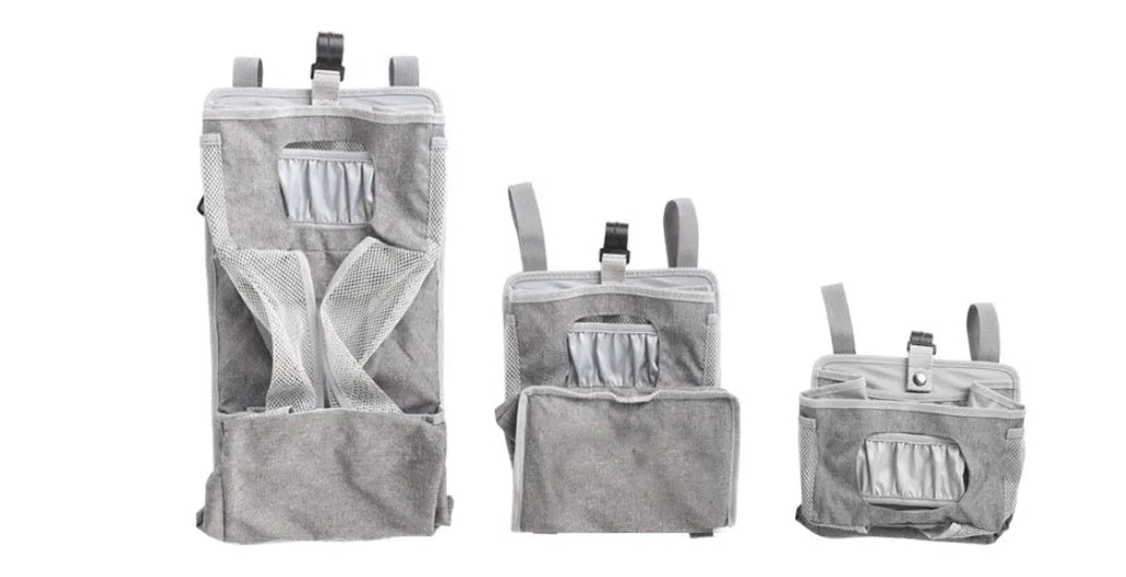 Grey attachable storage bag with diamond mesh panel and PP support plate, 44.6x23x16cm, hung on a white baby cot