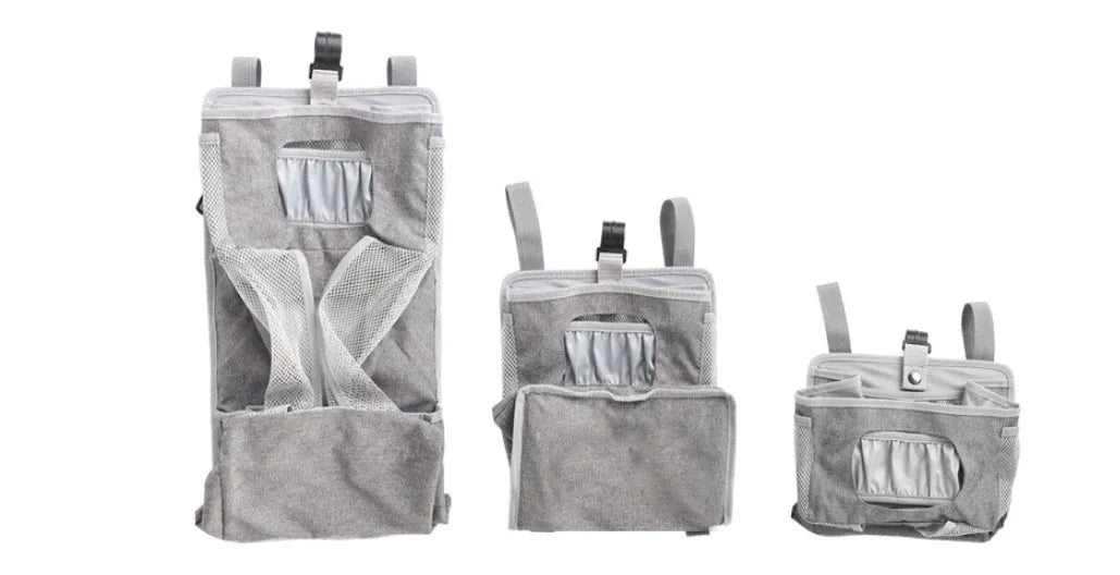 Grey attachable storage bag with diamond mesh panel and PP support plate, 44.6x23x16cm, hung on a white baby cot