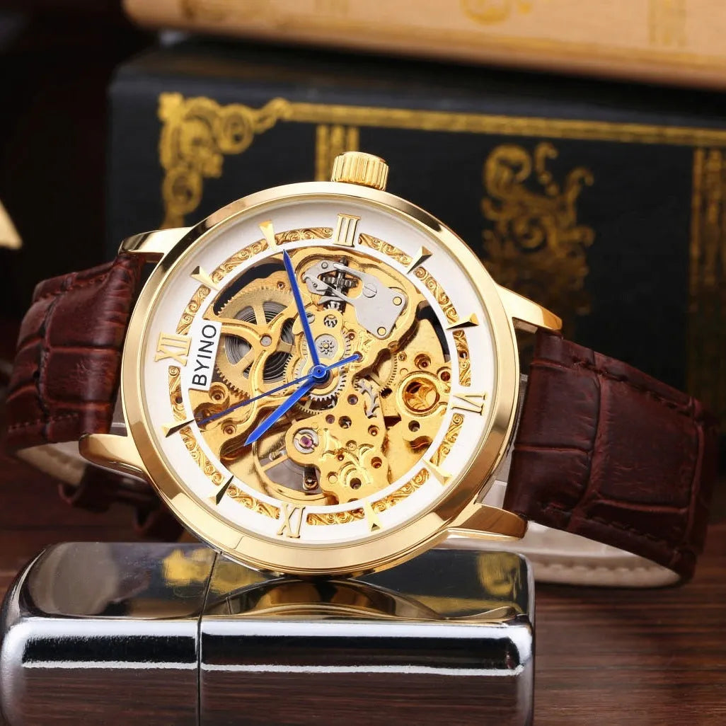 Men's automatic mechanical watch with hollow skeleton dial, leather strap, gold-tone casual design, waterproof