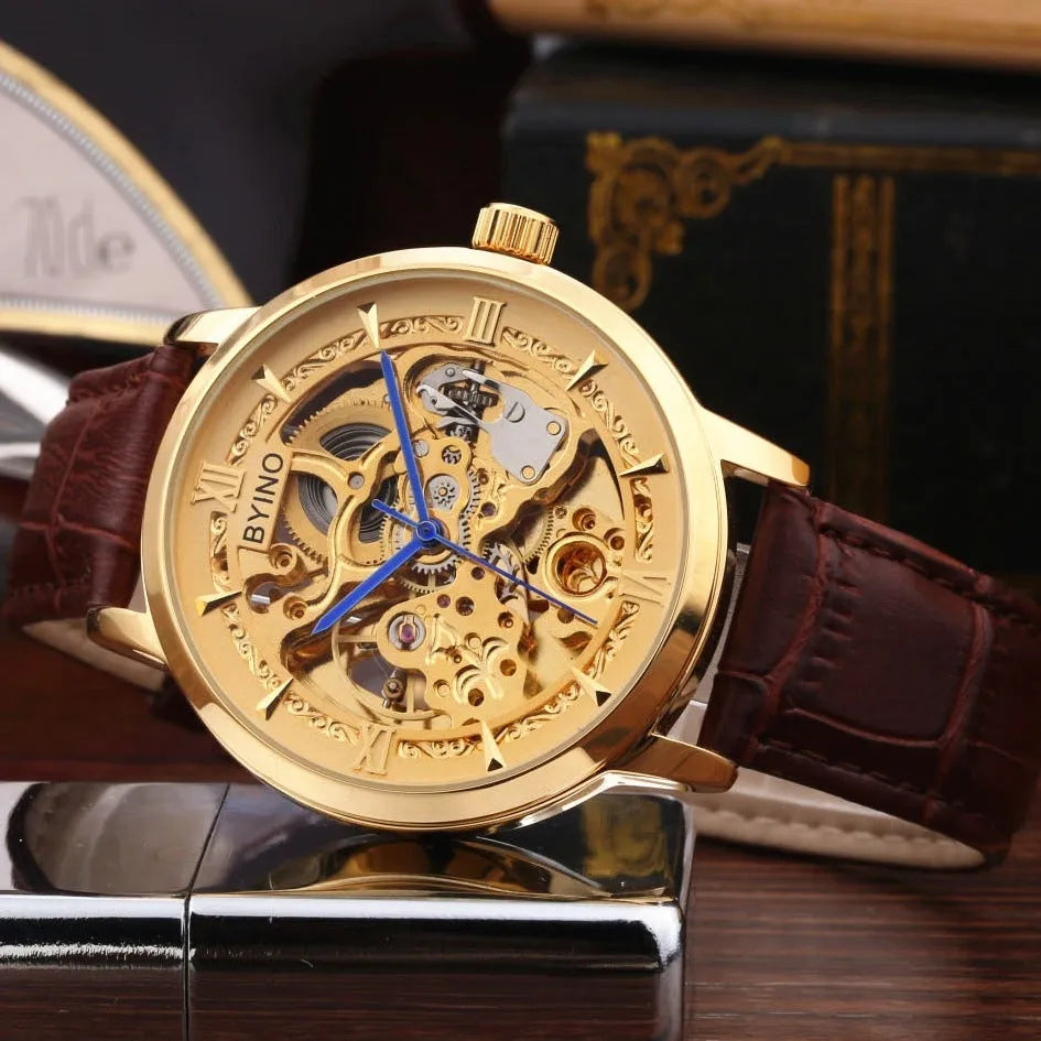 Men's automatic mechanical watch with hollow skeleton dial, leather strap, gold-tone casual design, waterproof