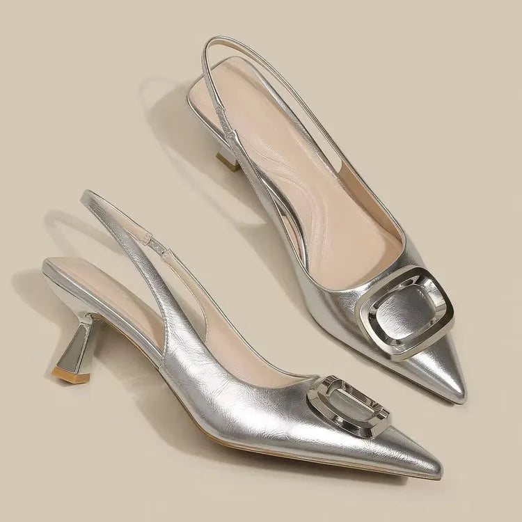 Pointed toe classy high heels with French square buckle in black, cream white, and silver. Microfiber and rubber construction. Sizes 35 to 39.