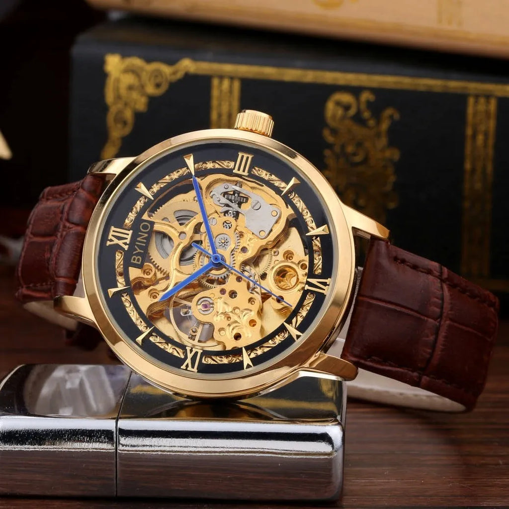 Men's automatic mechanical watch with hollow skeleton dial, leather strap, gold-tone casual design, waterproof