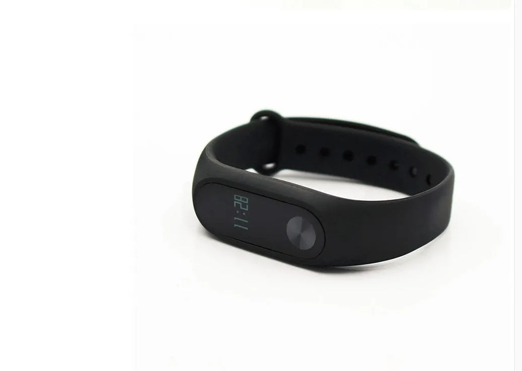 Xiaomi Mi Band 2 black fitness band with OLED screen on an adjustable wrist strap.