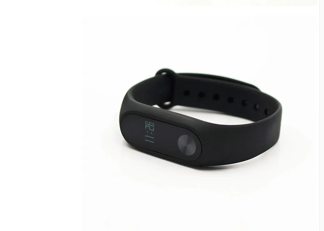 Xiaomi Mi Band 2 black fitness band with OLED screen on an adjustable wrist strap.