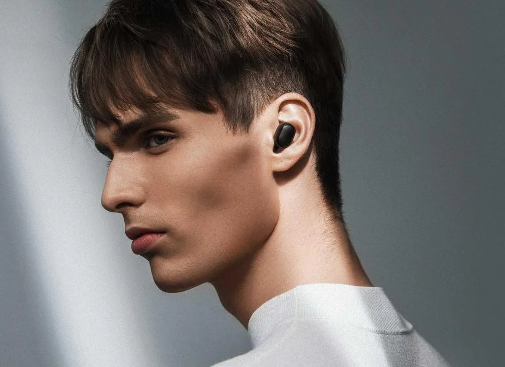 Redmi AirDots 2 black true wireless earbuds and charging case.