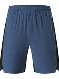 Man wearing forest green five-point spandex casual shorts with a mid-waist fit.